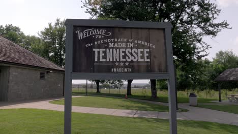 Welcome-to-Tennessee-sign-at-welcome-center-with-gimbal-video-walking-forward-in-slow-motion