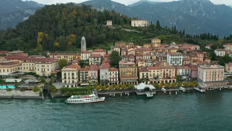 AERIAL:-Ferry-Waits-for-Passengers-to-board-in-Town-of-Bellagio-near-Lake-Como