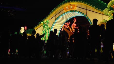 Silhouette-Of-People-At-Gardens-By-The-Bay-Mid-Autumn-Festival-Illuminated-Lantern-Display-At-Night