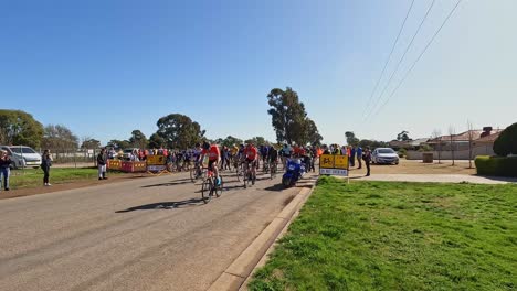 Yarrawonga,-Victoria,-Australia---21-August-2022:-A-group-of-road-race-cyclists-in-Yarrawonga-starting-their-race-and-heading-down-to-Wilby