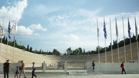 Tourists-walking-by-the-historic-Panathenaic-Stadium-in-Athens