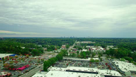 Aerial-over-Atlanta-north-Suburbs,-downtown-in-distance