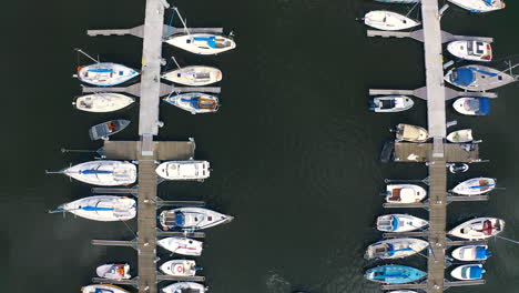 Top-view,-Aerial-shot-of-drone-flying-in-marina-in-Blotnik,-Pomeranian,-Poland