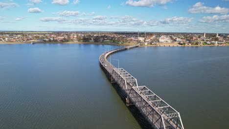 Over-the-Yarrawonga-Mulwala-bridge-on-Lake-Mulwala-towards-the-town-of-Yarrawonga,-Victoria,-Australia