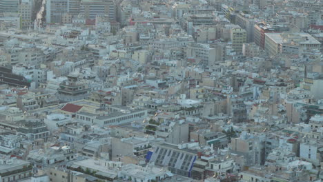 Close-up-aerial-of-Athens-dense-cityscape-at-twilight