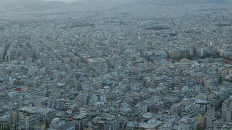 Dense-urban-sprawl-from-above,-showcasing-Athens'-cityscape-at-dusk