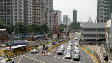 Traffic-Going-Past-Construction-Works-Along-Moulmein-Road-In-Novena,-Singapore