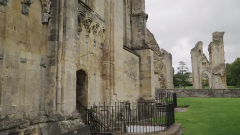 Glastonbury-Abbey-ruins,-camera-tilt-top-to-bottom-4k-slow-motion