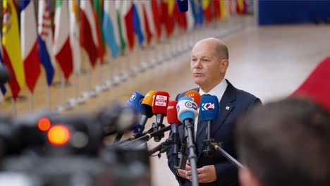 Chancellor-of-Germany-Olaf-Scholz-talking-to-the-press-at-the-European-Council-summit-in-Brussels,-Belgium---Slow-motion