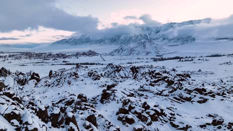 Wide-pan-drone-shot-of-the-Sierra-mountains-and-the-Alabama-hills,-California-with-fresh-snow