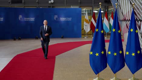 Chancellor-of-Germany-Olaf-Scholz-arriving-on-the-red-carpet-at-the-European-Council-summit-in-Brussels,-Belgium---Slow-motion