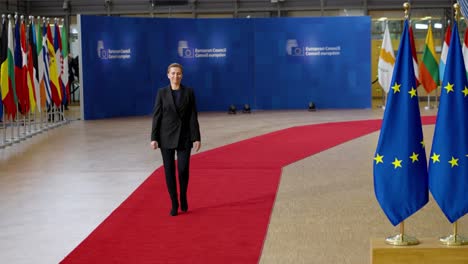 Danish-Prime-Minister-Mette-Frederiksen-arriving-on-the-red-carpet-at-the-European-Council-summit-in-Brussels,-Belgium---Slow-motion