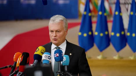 Lithuanian-President-Gitanas-Nausėda-talking-to-the-press-at-the-European-Council-summit-in-Brussels,-Belgium---Slow-motion-shot