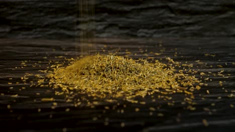 Aromatic-Thyme-Herb-Spice-Falling-in-a-small-Pile-with-a-Dark-Textured-Background