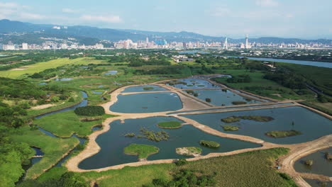Aerial-Shot-Of-Urban-Wetlands-At-Guandu-Nature-Park,-Taipei,-Establishing-Shot