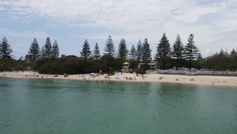 Safe-family-swimming-area-with-lifesavers-at-the-popular-holiday-spot-Tallebudgera-Beach-Gold-Coast-Australia