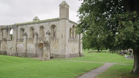 Glastonbury-Abbey-ruins-main-entrance,-camera-pan-right-to-left-4k-slow-motion
