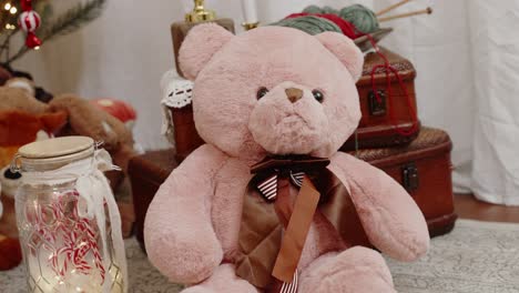 Plush-teddy-bear-with-striped-bow-tie-amidst-vintage-Christmas-decor
