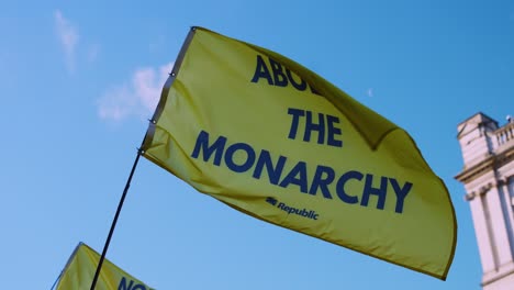 Anti-Monarchy,-Pro-Republic-Protest-Flag-saying-'Abolish-the-Monarchy'-in-Westminster,-London-at-State-Opening-of-Parliament-Demonstration