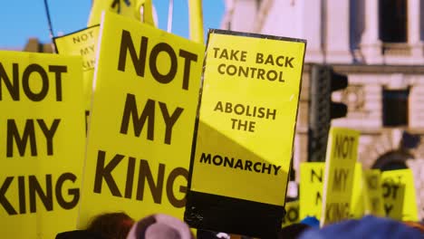 Anti-Monarchy,-Pro-Republic-Protest-Flags-and-Signs-saying-'Not-My-King'-about-the-Royal-Family-in-Westminster,-London-at-State-Opening-of-Parliament-Demonstration