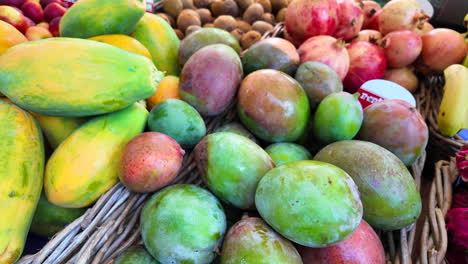 Exotic-fruits-for-sale-at-an-organic-farmers-market-with-fresh-bio-dragon-fruit,-mango,-papaya,-pomegranate,-kiwi-and-banana,-4K-shot