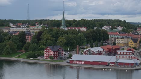 Telephoto-aerial-establisher-Scandinavian-city-motala,-sweden-house-architecture