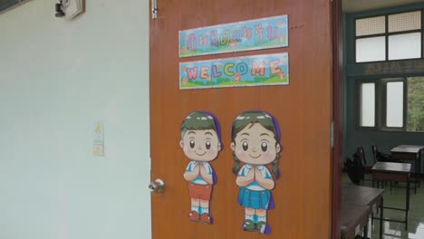 Step-into-a-local-Thai-school-classroom,-where-a-warm-'Welcome'-sign-sets-the-tone-for-an-inviting-and-inclusive-learning-space