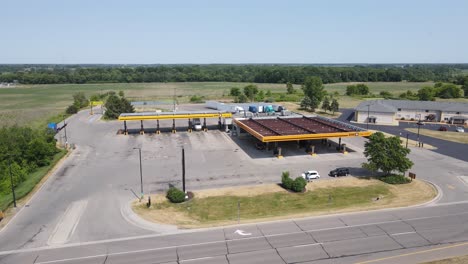 Truck-stop-with-gas-station-on-highway-road-side,-aerial-view