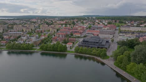 Scenic-aerial-dolly-in-modern-scandinavian-city-motala-in-Sweden,-cloudy-day