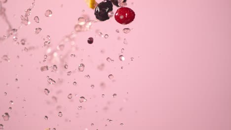 Water-Splashes-Several-Raspberries-Blackberries-And-Lemon-Slices-Upwards