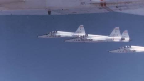 Tight-Formation-of-1960s-USAF-T-38-Talons---Fighter-Cockpit-POV-in-Blue-Sky