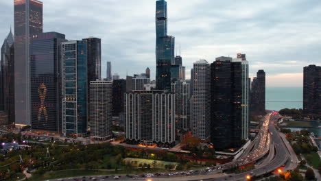 Hyperlapse-drone-shot-of-traffic-on-the-Lake-shore-drive-in-front-of-New-Eastside-and-parks-of-Chicago