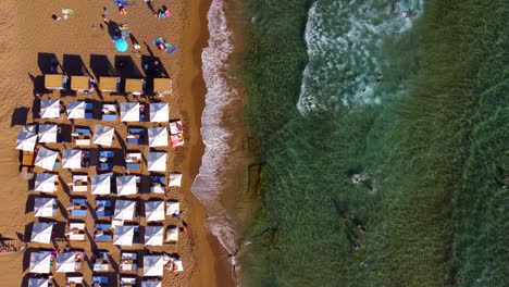 Top-Down-Drone-View-of-People-Swimming-at-Glyfada-Beach-in-Corfu-Island-in-Greece