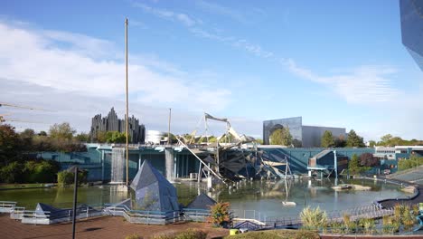 Futuroscope-theme-park-with-lake-and-buildings-on-daytime,-Wide-stable-shot