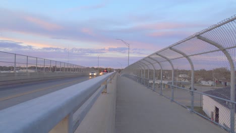 Cars-drive-over-an-overpass-at-dusk