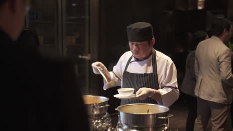 A-chef-personally-serves-steaming-bowls-of-soup-at-the-event-reception