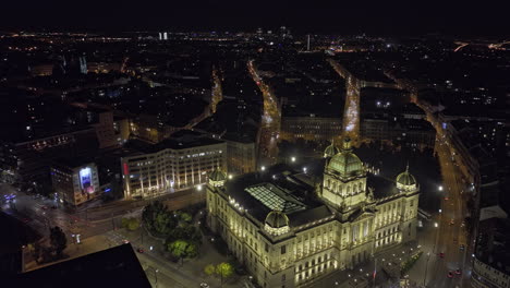 Prague-Czechia-Aerial-v100-cinematic-low-birds-eye-view-drone-flyover-illuminated-national-museum-capturing-its-grand-exterior-and-new-town-cityscape-at-night---Shot-with-Mavic-3-Cine---November-2022