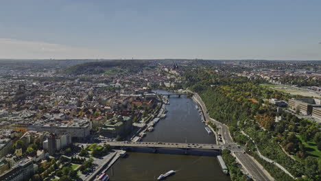 Prague-Czechia-Aerial-v47-cinematic-drone-flyover-Vltava-river-across-Petrska-Ctvrt-neighborhood-capturing-Letna-park-and-Old-town-cityscape-on-a-sunny-day---Shot-with-Mavic-3-Cine---November-2022