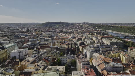 Prague-Czechia-Aerial-v56-establishing-shot-drone-flyover-Petrska-Ctvrt-neighborhood-capturing-cityscape-of-historical-Old-Town-on-a-sunny-day---Shot-with-Mavic-3-Cine---November-2022