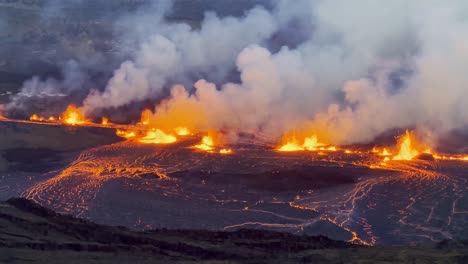 Cinematic-long-lens-shot-of-the-illuminated-lava-lake-as-Kilauea-Volcano-erupts-at-sunset-on-the-first-evening-of-activity-in-Hawai'i-Volcanoes-National-Park