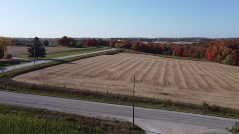 Rising-Aerial-Shot-Of-Agricultural-Farmland-During-Fall-In-Caledon