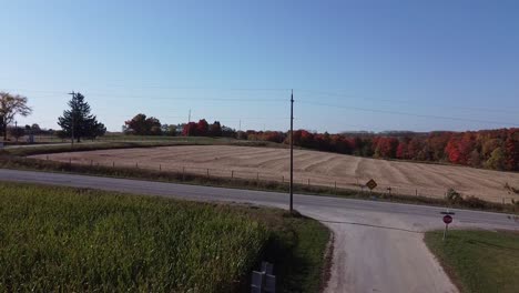 Agricultural-Farm-Land-During-Fall-Peak-Colours,-Rising-Aerial-Shot