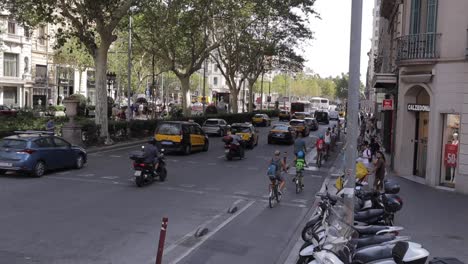 Busy-Traffic-with-bikes-and-cars-Intersection-in-Barcelona:-Daytime-Chaos