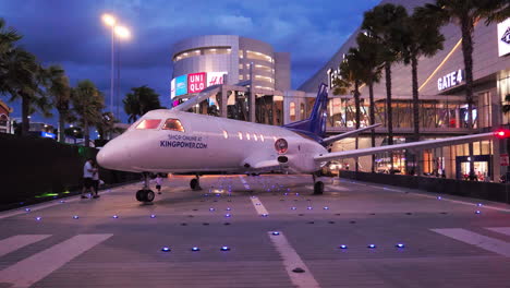 Exhibit-of-life-size-replica-of-an-airplane-set-outside-of-a-mall