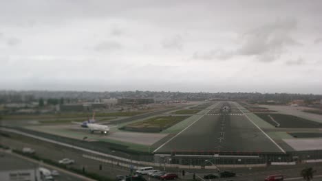A-timelapse-of-planes-taking-off-and-landing-at-San-Diego-International-Airport,-shot-with-a-tilt-shift-lens-for-a-miniature-effect
