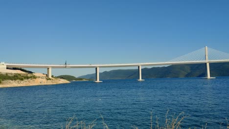 Panning-shot-of-Bridge-Pelješac-in-Croatia-on-sunny-day
