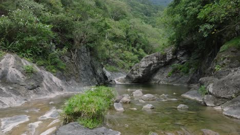 River-water-flows-through-the-Rocky-Canyons-in-Salto-Las-Yayitas,-El-Recodo,-Bani,-Dominican-Republic