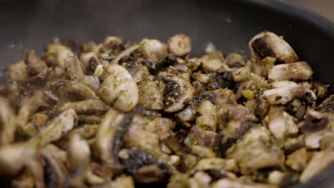 -Cooking-mushrooms-in-a-pan--Close-up--29,97-Fps--Shot-on-Canon-R5C