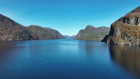 Veafjorden-fjord-and-Stanghelle-town-at-autumn,-mid-sea-aerial-Norway