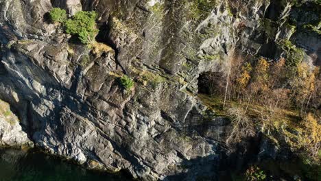 Unique-Cliffside-Tunnel-along-Decommissioned-Bergen-railway-at-Stanghelle,-Aerial-looking-down